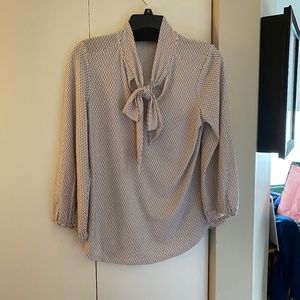 cream colored polka dot blouse